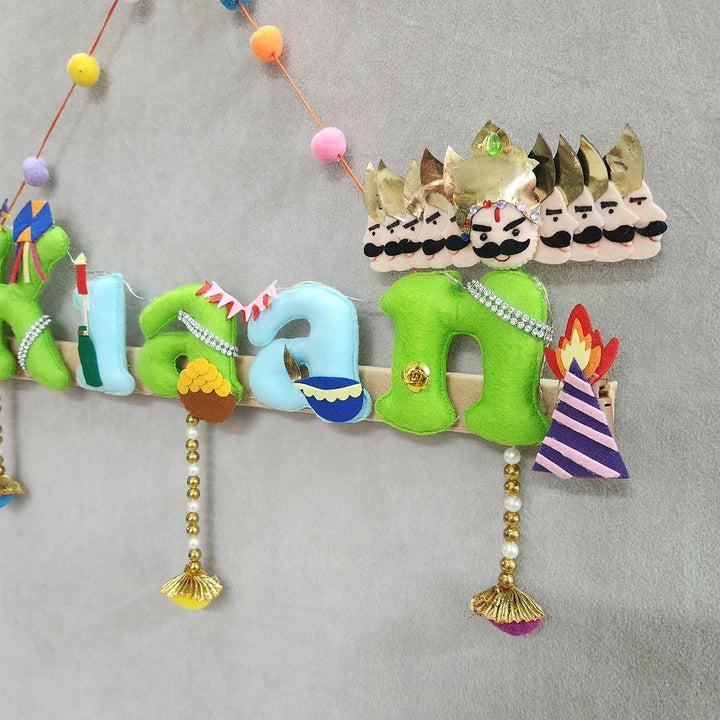 Personalized Shri Ram Ji And Ravan Theme Felt Kids Name Plate - Close-up of Hanging Decorative Letters