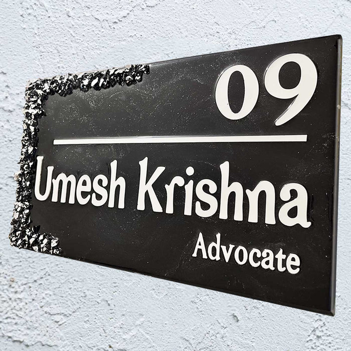Personalized Black And Silver Resin Name Plate - Angled View Mounted on Wall
