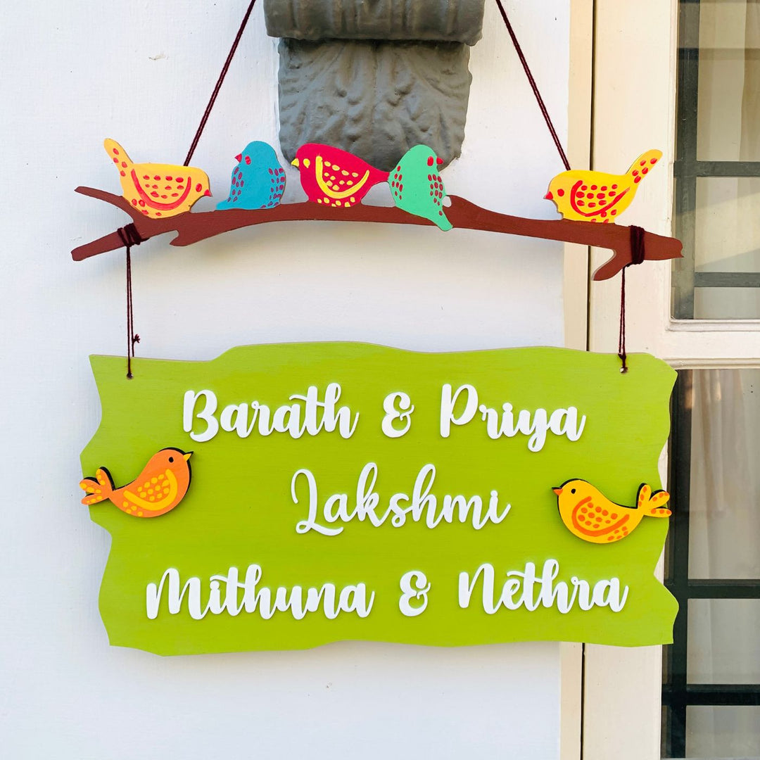 Personalized Sparrow Family Plank Nameplate - Front View Hanging on Wall