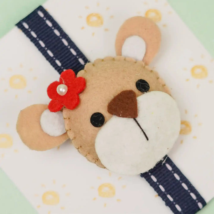 Handmade Bear Theme Felt Kids Rakhi With Roli Chawal - Close-up of Bear Face Detail