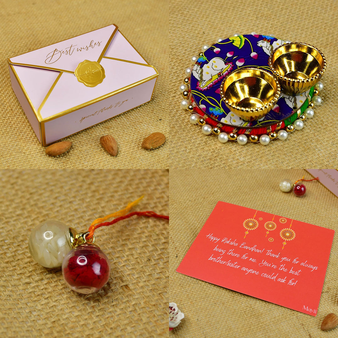 Red Floral Pearl And Stone Bracelet Rakhi Hamper With Chocolates And Roli Chawal For Brother Customizable Options Includes Up To 7 Goodies - Arranged Rakhi Components on Surface