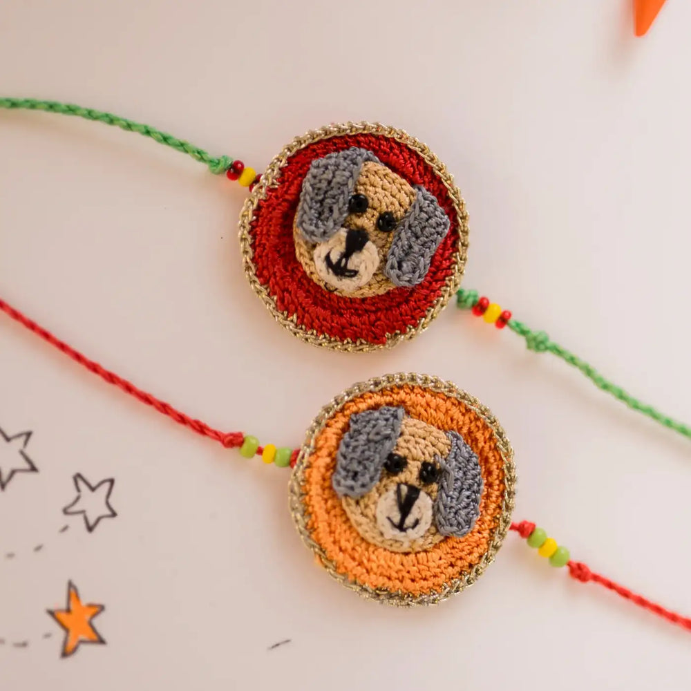 Handmade Crochet Dog Theme Kids Rakhi With Roli Chawal Set Of 2 - Close-up of crochet dog faces