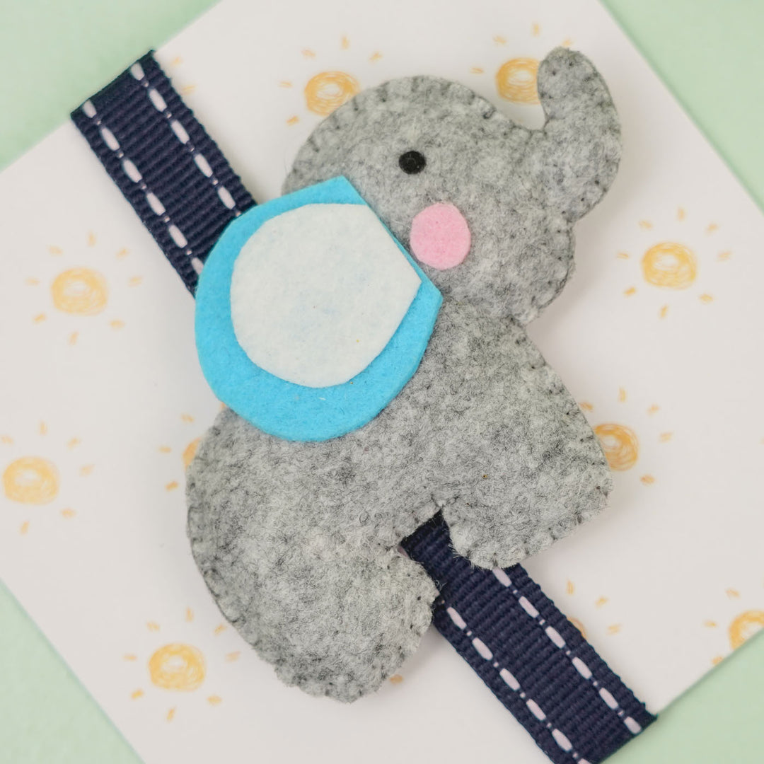Handmade Elephant Theme Felt Kids Rakhi With Roli Chawal - Close-up on Gray Elephant Ornament