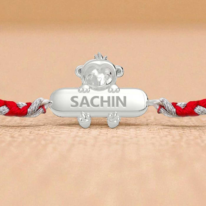 Personalized Handmade Monkey Design Silver Kids Rakhi - Detailed Nameplate Close-up