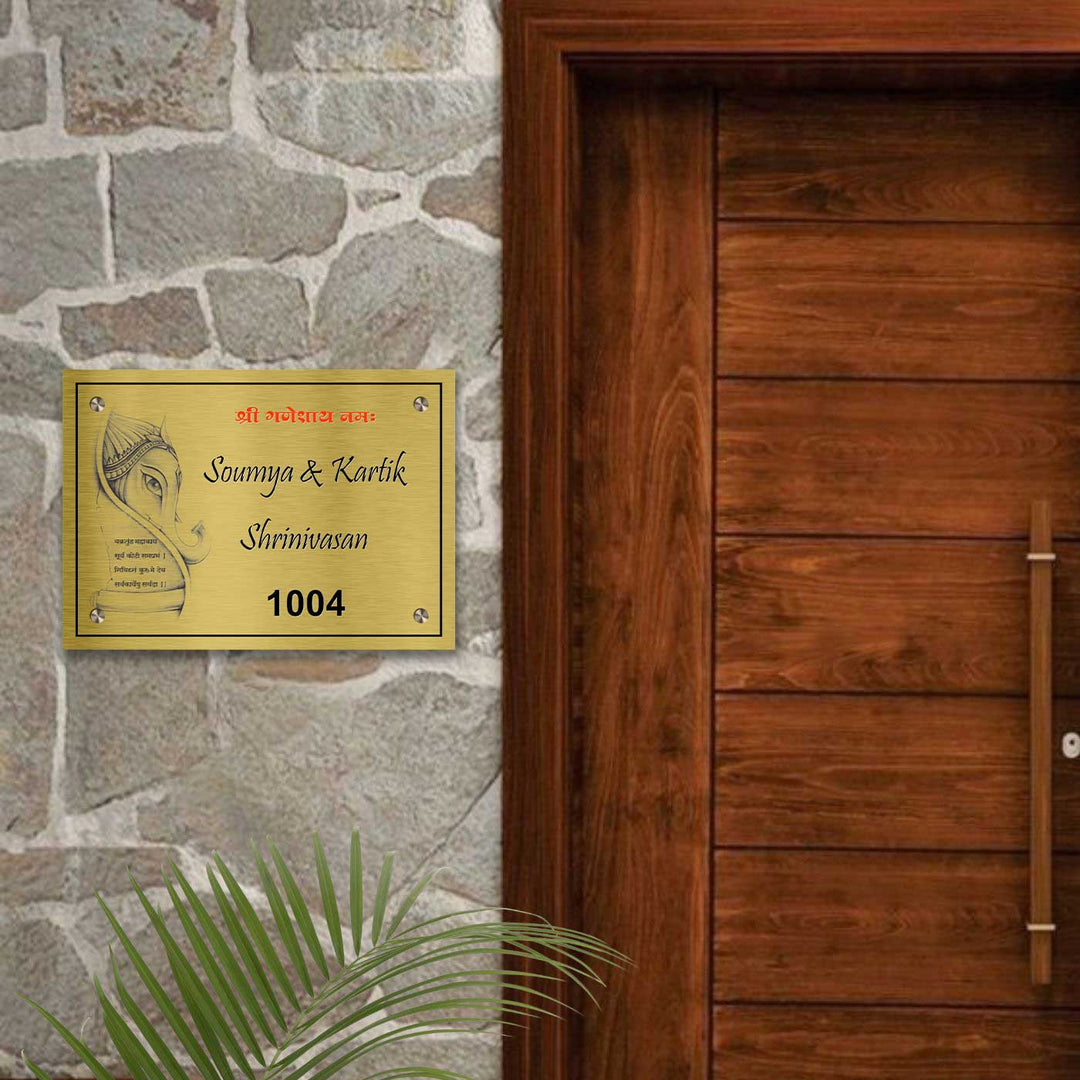 Personalized Weatherproof Ganesha Theme Gold Stainless Steel Name Plate - Mounted on Stone Wall Near Door