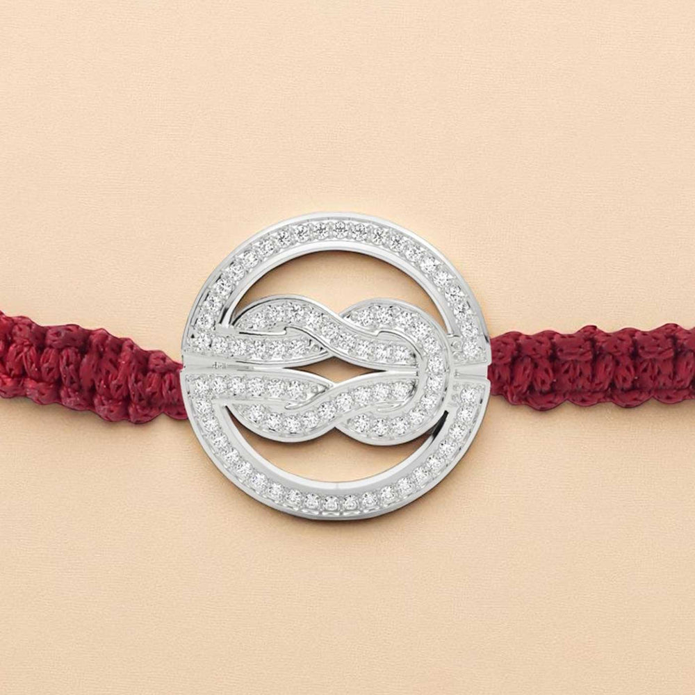 Handmade Knot Design Silver Rakhi For Brother - Extreme Close-up of Charm