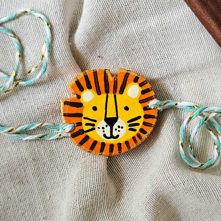 Handpainted Quirky Wooden Rakhi With Roli Chawal 14 - Close-up of single rakhi