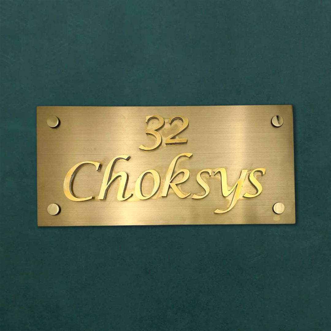 Personalized Weatherproof Rectangle Engraved Gold Stainless Steel Name Plate - Front View on Flat Surface