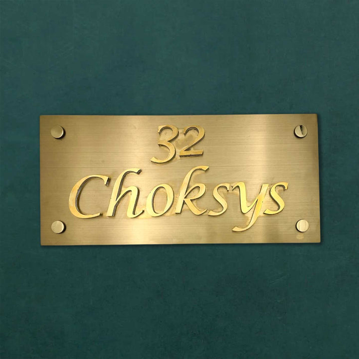 Personalized Weatherproof Rectangle Engraved Gold Stainless Steel Name Plate - Front View on Flat Surface