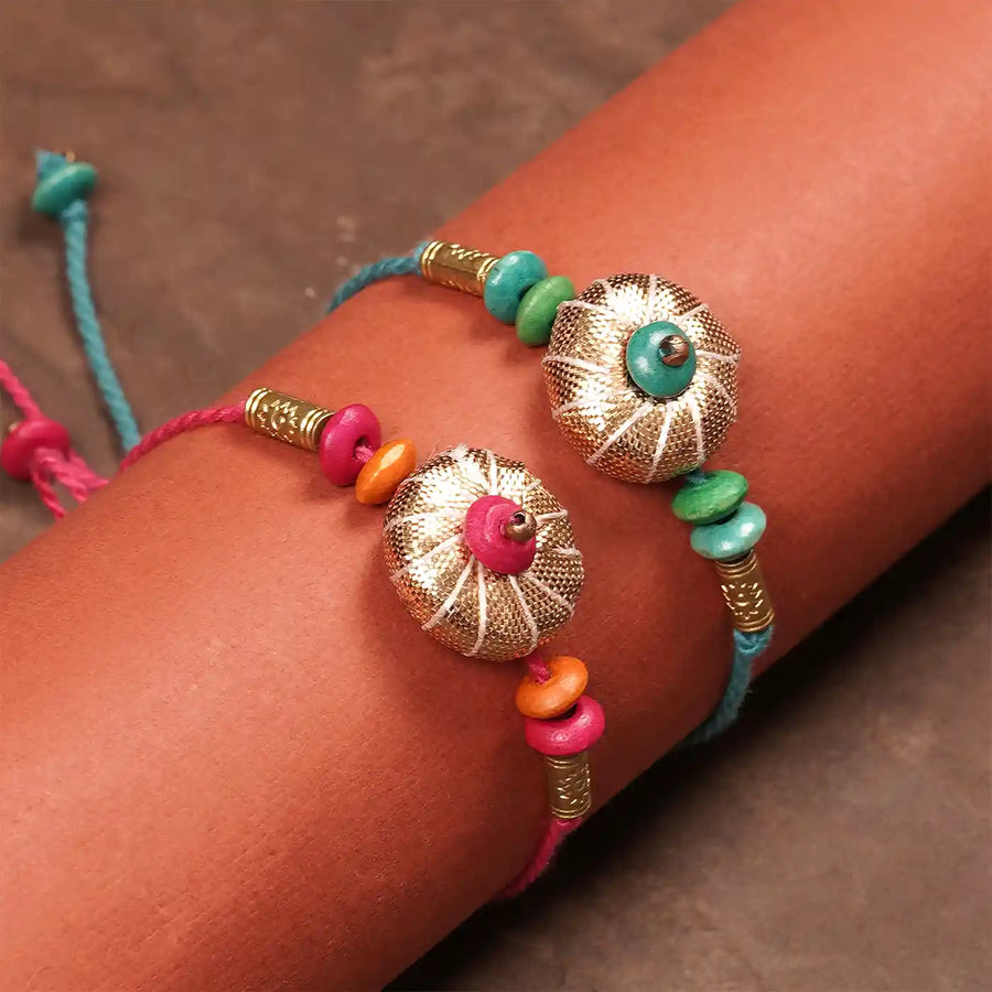 Handmade Gota Patti Blue And Pink Rakhi With Roli Chawal Set Of 2 - On Wrist Close-up