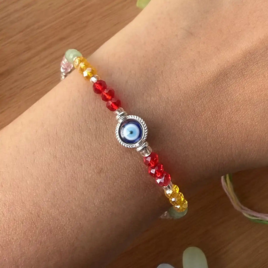 Handmade Round Beaded Evil Eye Rakhi With Roli Chawal - Worn on Wrist