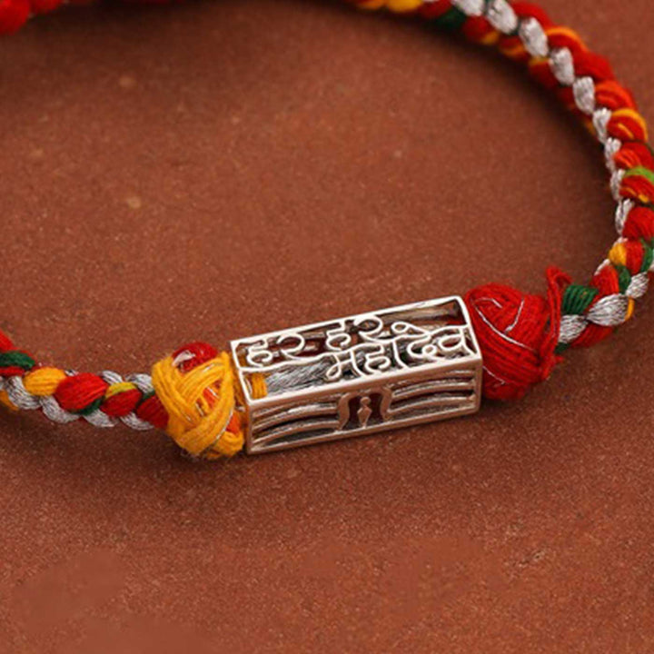Handmade Har Har Mahadev Design Religious Silver Rakhi For Brother - Close-up of Rakhi metal charm