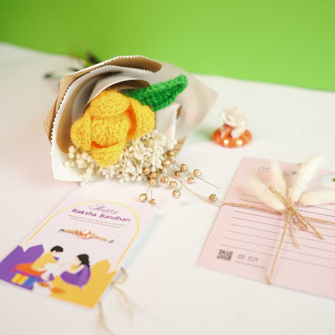 Personalized Handmade Crochet Tulip Dried Bunch Rakhi Hamper Includes 1 Crochet Flower Bunch 1 Message Card And 1 Rakhi And Roli Chawal - Flat Lay with Packaging
