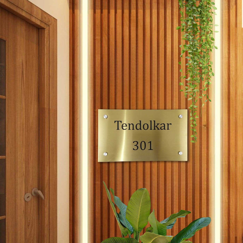 Personalized Weatherproof Minimalist Gold Stainless Steel Name Plate - Mounted on Wooden Entryway Wall