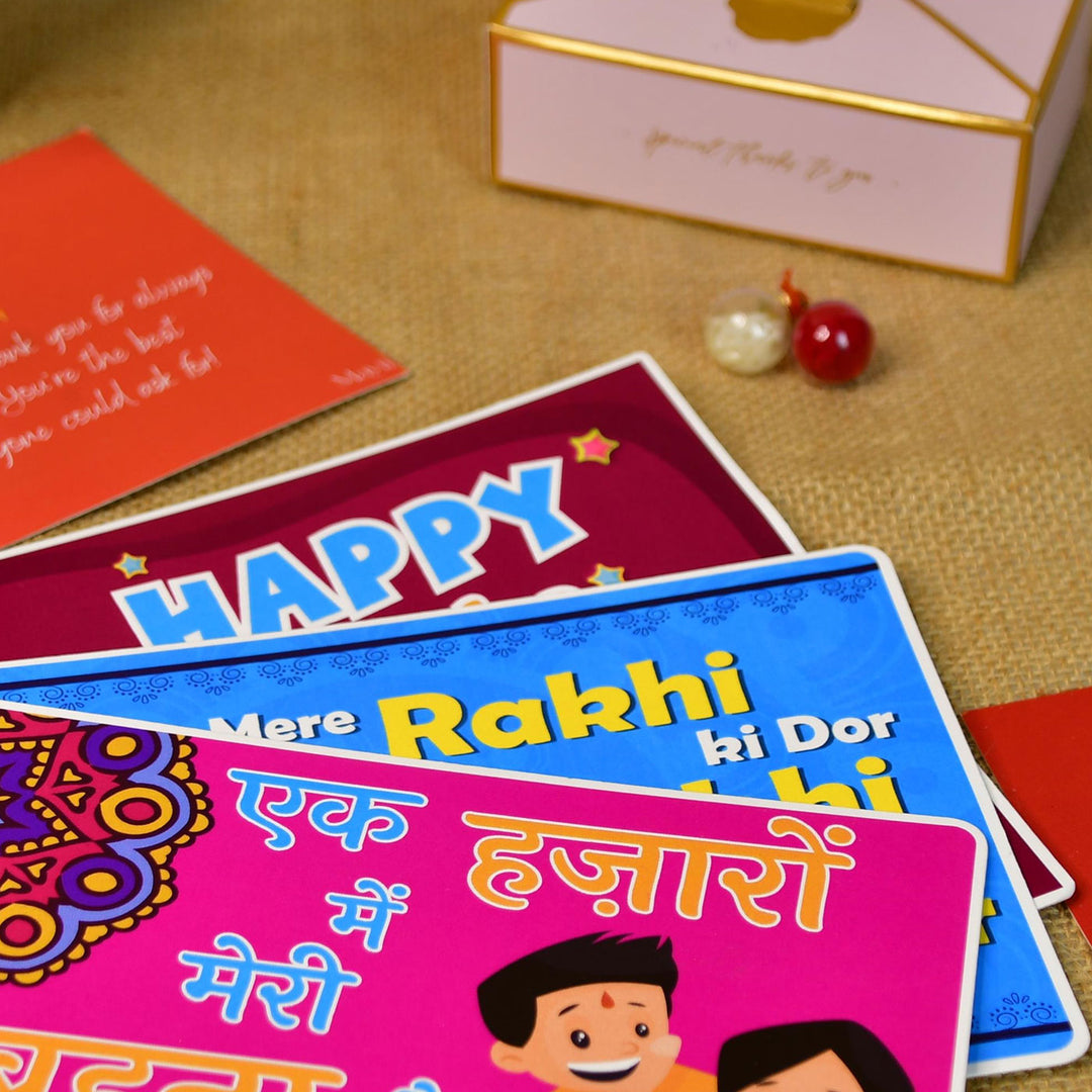 Red Floral Pearl And Stone Bracelet Rakhi Hamper With Chocolates And Roli Chawal For Brother Customizable Options Includes Up To 7 Goodies - Stack of Greeting Cards