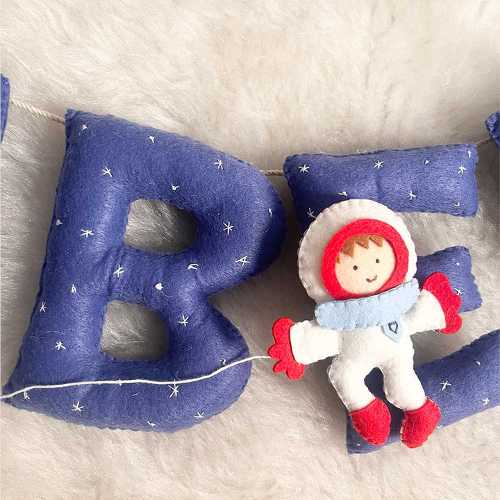 Handcrafted Personalized Space Themed Bunting For Kids - Close-up of Stuffed Letters and Doll