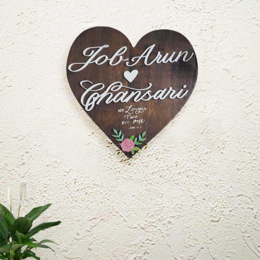 Personalized Brown Heart Shaped Pine Wood Name Plate - Mounted on Textured Wall