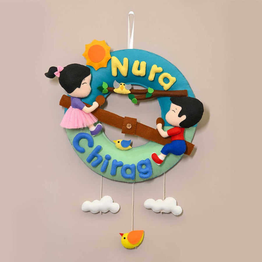 Personalized See Saw Theme Round Felt Kids Nameplate For Siblings - Front View Hanging on Wall