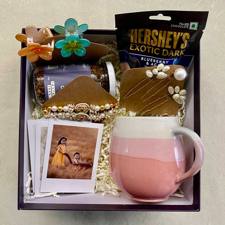 Photo Personalized Handmade Threads And Treasures Rakhi Hamper Includes 1 Mug 2 Clips 5 Photos 3 Hair Pin 1 Marble Lotus 1 Chocolate 1 Coffee And 1 Set Rakhi - Gift Box Top View