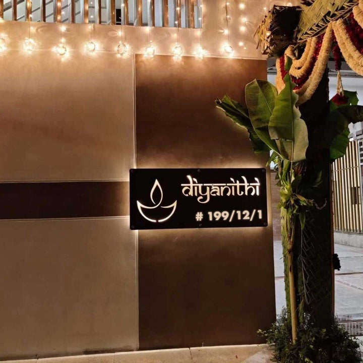 Personalized Waterproof Diya Design Laser Cut Metal Led Name Plate - Mounted on Exterior Wall at Night