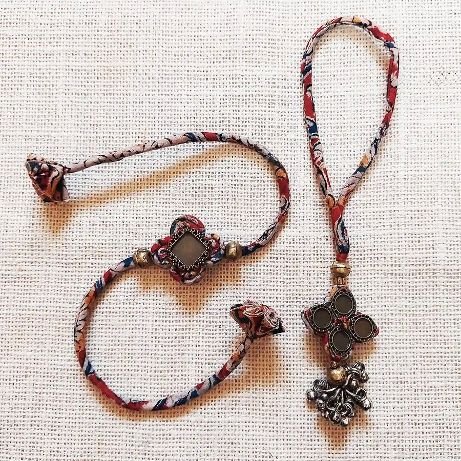 Handmade Dori Work Kalamkari Bhaiya Bhabhi Rakhi With Roli Chawal Set Of 2 - Set Front View