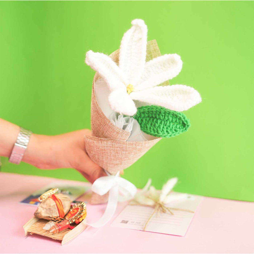 Personalized Handmade Crochet White Lily Rakhi Hamper Includes 1 Crochet Flower 1 Message Card And 1 Rakhi And Roli Chawal - Hand Holding Crocheted Flower Bouquet