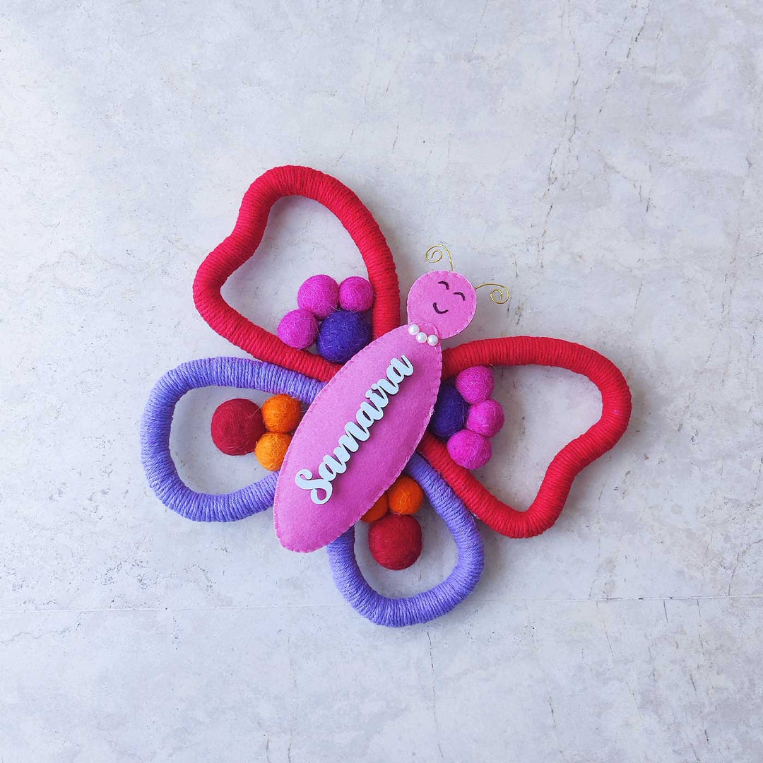 Personalized Handmade Macrame Butterfly Kids Name Plate With 3D Letters - Top View on Flat Surface