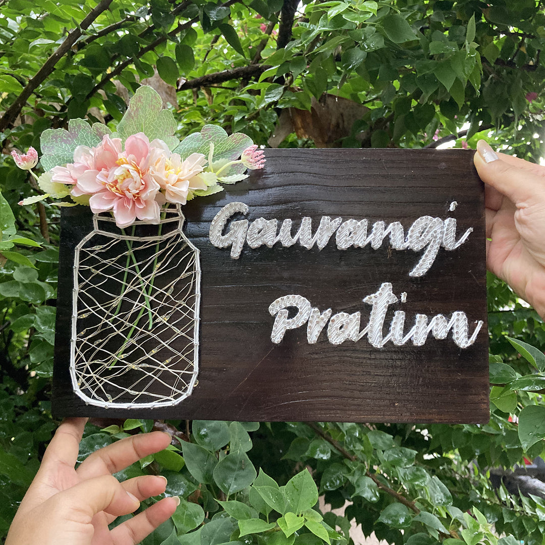 Personalised Couple Name Plate With Fairy Light String Art - Name Personalization Example Held Outdoors