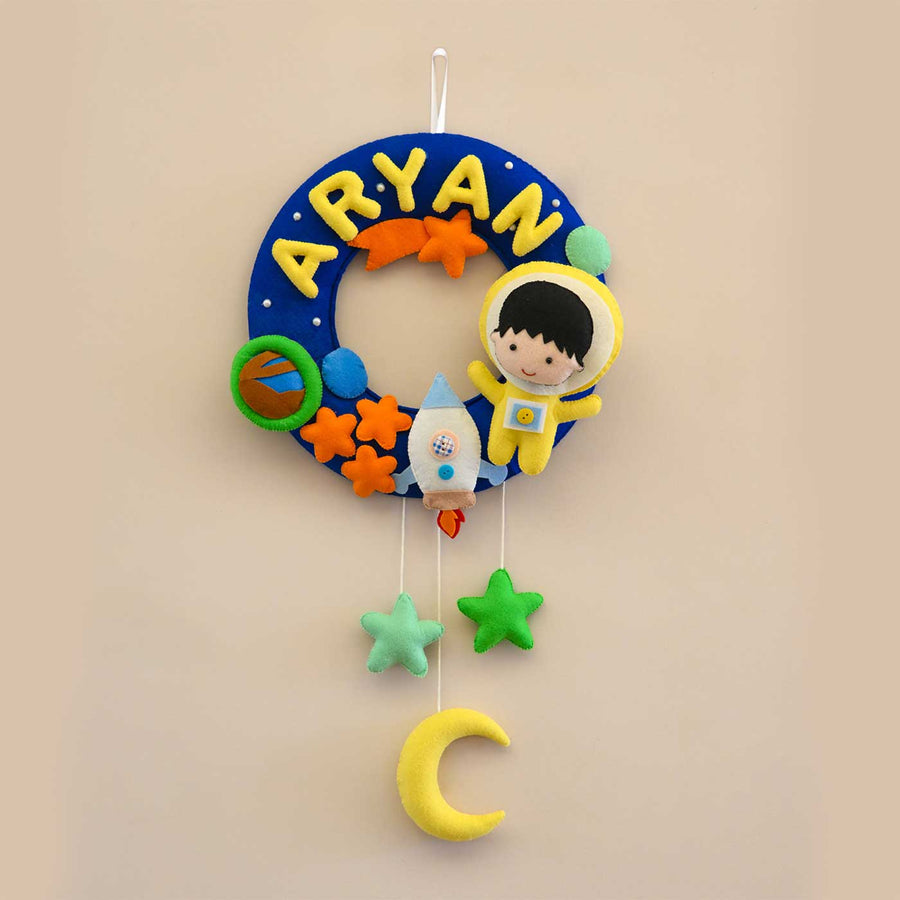 Personalized Space Voyager Theme Round Felt Kids Nameplate - Front View Hanging on Wall