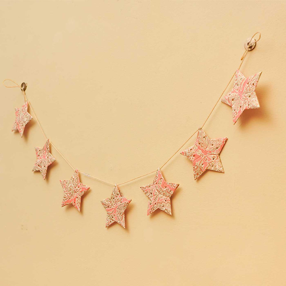 Handmade Paper Anokhi Pink Star Bunting - Hanging Decoration Displayed on Wall