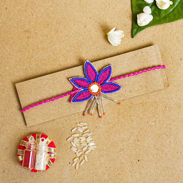 Handmade Beaded Lotus Stone Rakhi With Roli Chawal - Flat Lay with Rakhi and Accessories