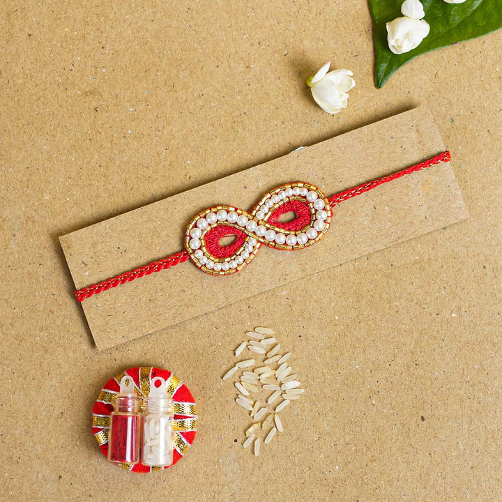 Handmade Beaded Infinity Rakhi With Roli Chawal - Packed with Rakhi Accessories