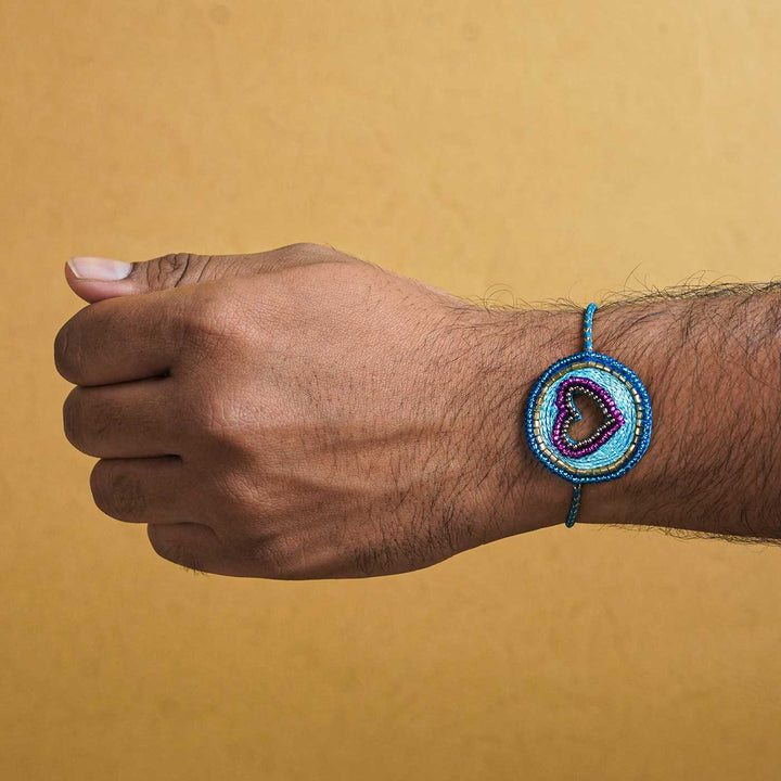 Handmade Beaded Heart Rakhi With Roli Chawal - Bracelet worn on wrist