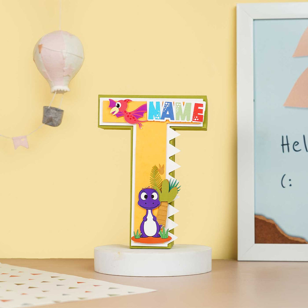Personalized Printed Dinosaur Theme For Boy Cardstock Monogram - Front View on Decorative Stand