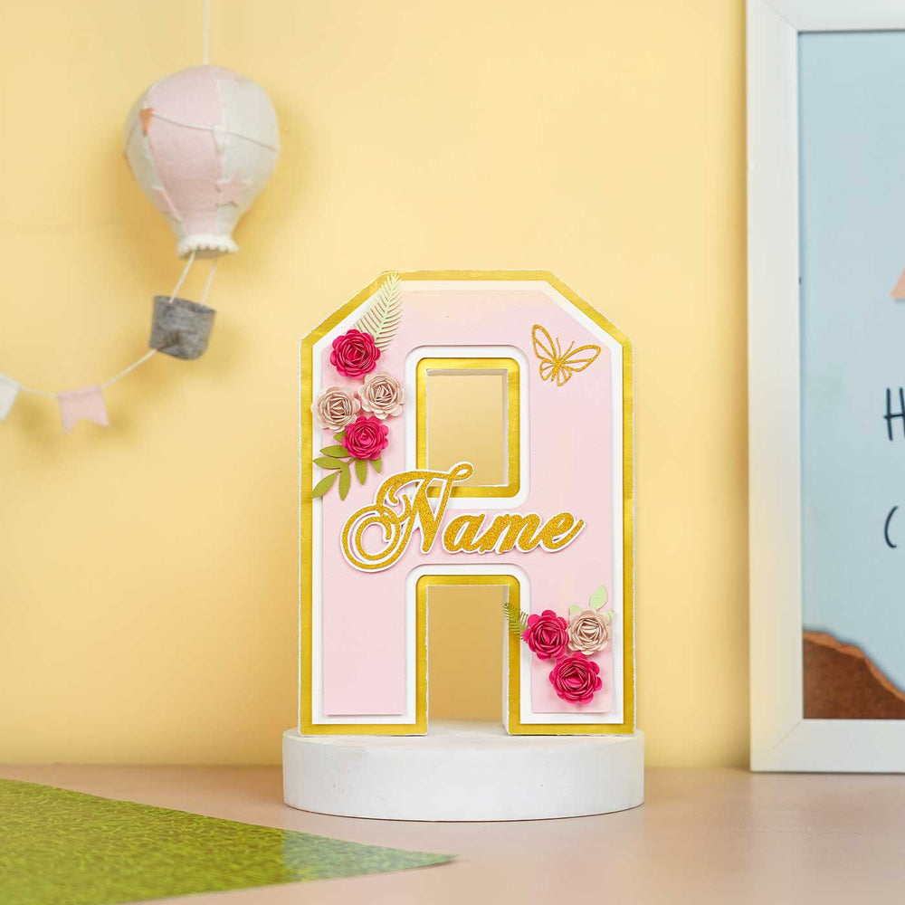 Personalized Printed Floral And Butterfly 3D Cardstock Monogram For Kids - Front View on Tabletop Stand