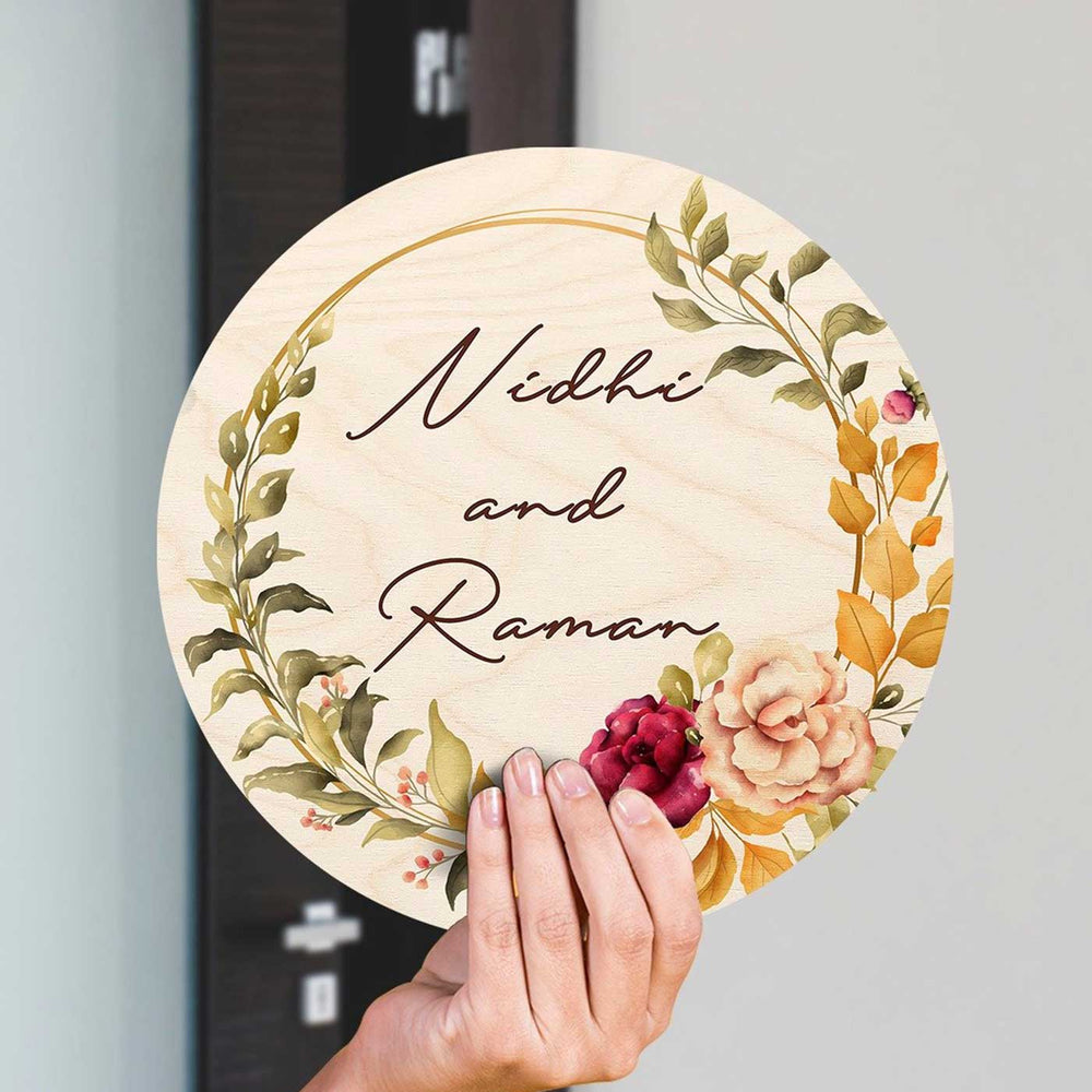 Printed Floral Wooden Round Nameplate For Couples - Handheld Front View with Personalization