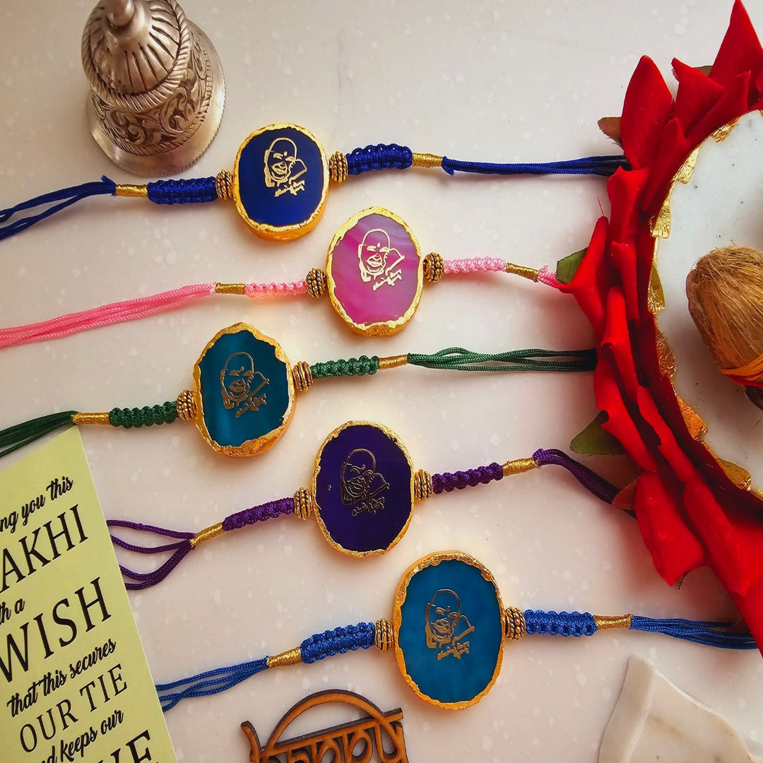 Handmade Shree Sai Baba Agate Rakhi With Roli Chawal For Brother - Multiple Rakhis Flat Lay