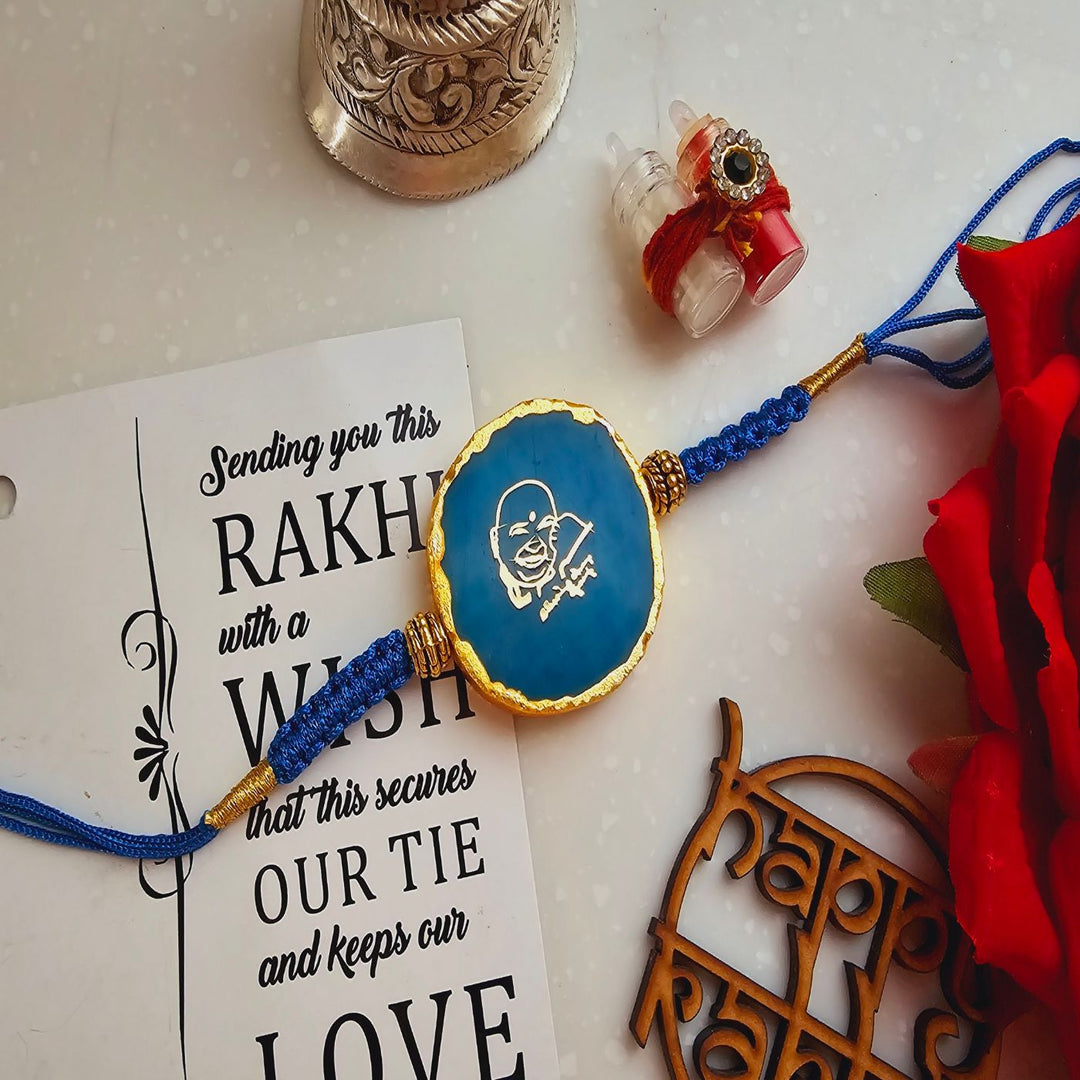 Handmade Shree Sai Baba Agate Rakhi With Roli Chawal For Brother - Close-up Front View Blue Rakhi
