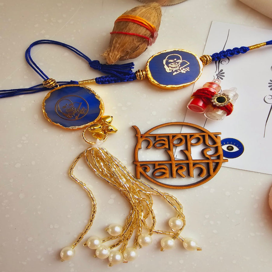 Handmade Shree Sai Baba Agate Bhaiya Bhabhi Rakhi With Roli Chawal - Close-up Flat Lay Display