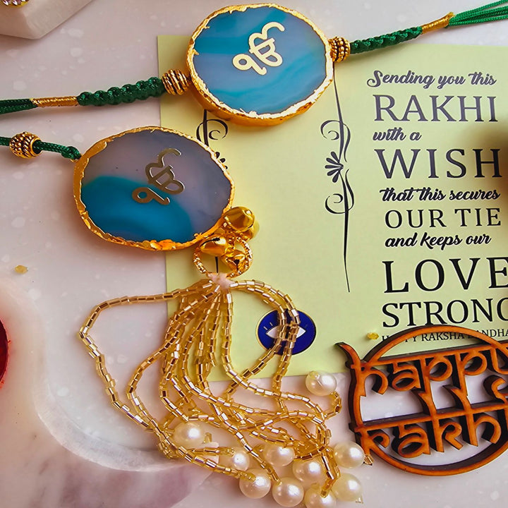 Handmade Ik Onkar Agate Bhaiya Bhabhi Rakhi With Roli Chawal - Front View with Jade Blue Stones