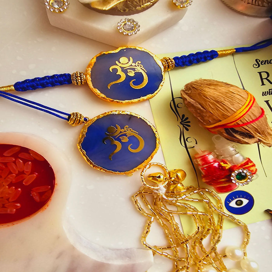 Handmade Om Agate Bhaiya Bhabhi Rakhi With Roli Chawal - Close-up of Blue Rakhi Pair