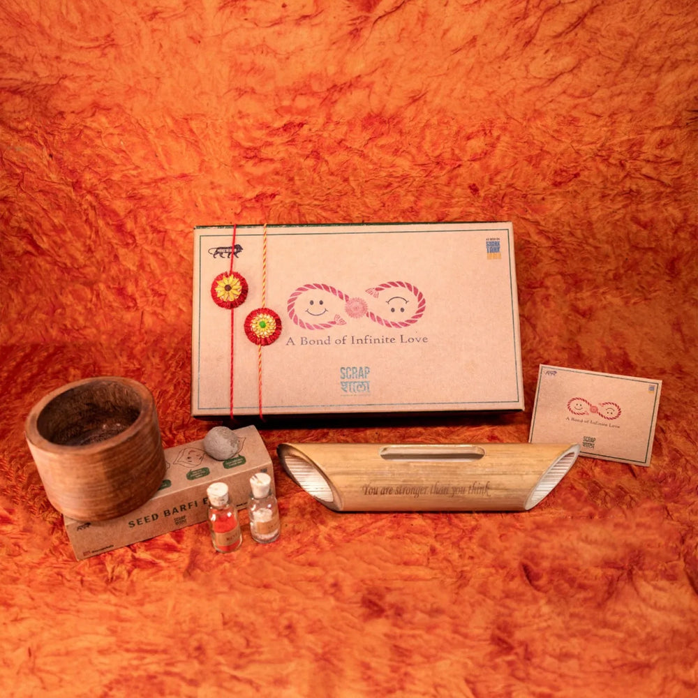 Akkad Bakkad Plantable Handmade Cork Rakhi Hamper With Roli Chawal - Rakhi gift set on table