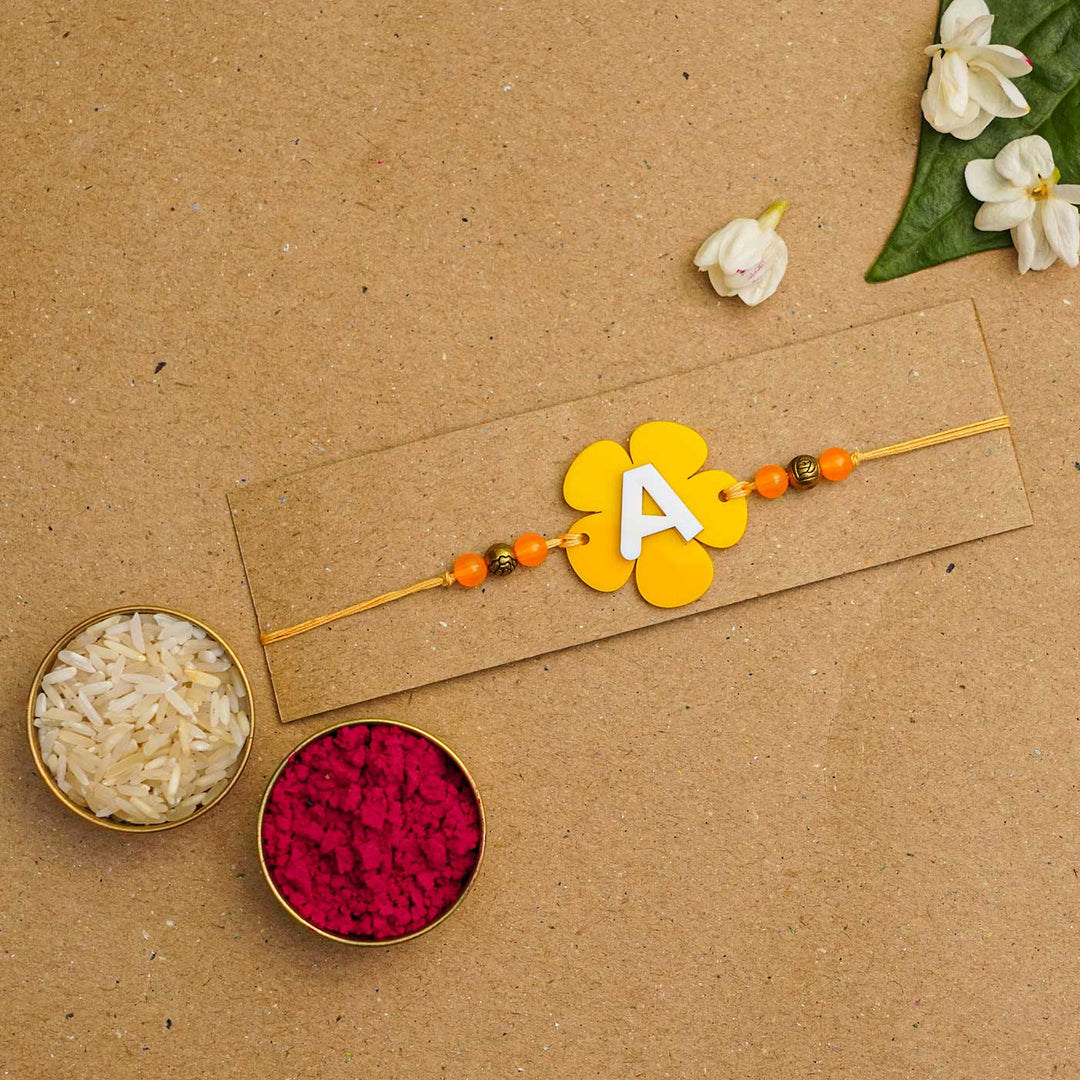 Personalized Handmade Alphabet Flower Acrylic Rakhi With Roli Chawal - Packaged with rice and powder (5)