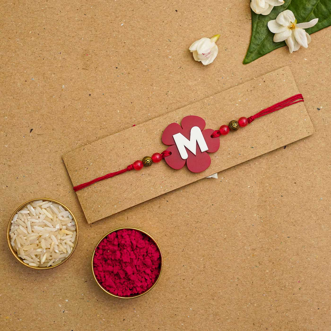 Personalized Handmade Alphabet Flower Acrylic Rakhi With Roli Chawal - Packaged with rice and powder