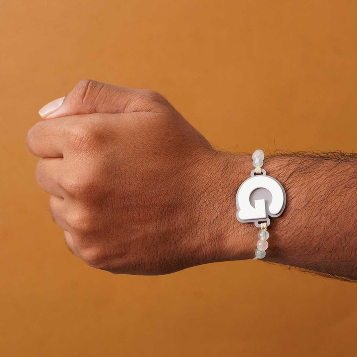 Personalized Handmade 3D Alphabet Acrylic Rakhi With Roli Chawal - Letter G Bracelet on Wrist