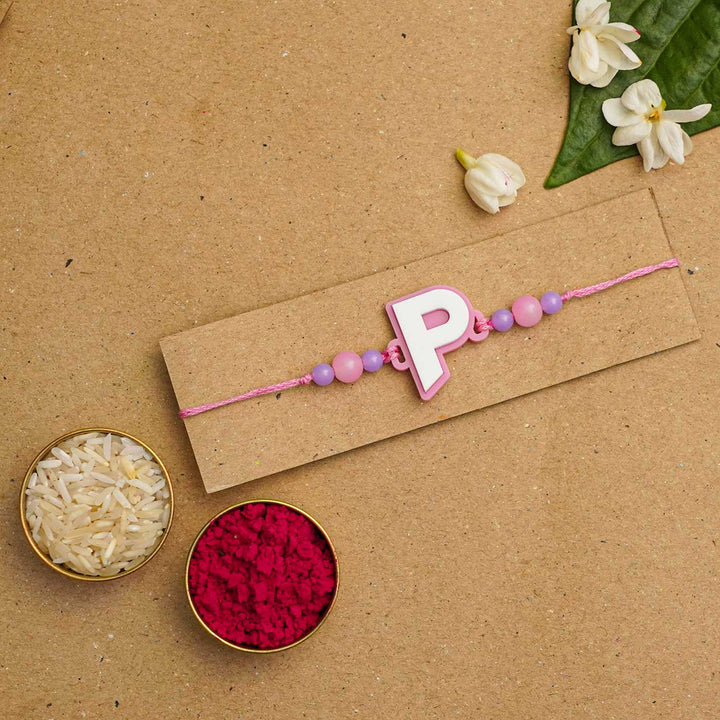Personalized Handmade 3D Alphabet Acrylic Rakhi With Roli Chawal - Letter P Packaging Display