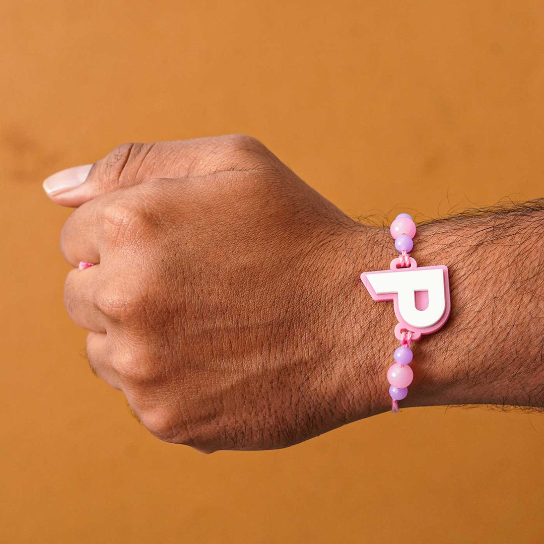 Personalized Handmade 3D Alphabet Acrylic Rakhi With Roli Chawal - Letter P Bracelet on Wrist