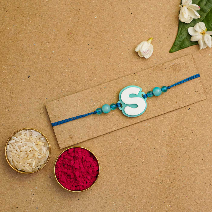 Personalized Handmade 3D Alphabet Acrylic Rakhi With Roli Chawal - Letter S Packaging Display