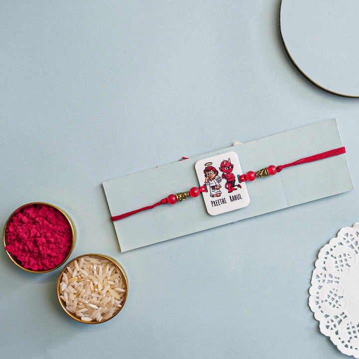 Personalized Handmade Printed Bro And Sis Acrylic Rakhi With Roli Chawal - Flat Lay with Ritual Items