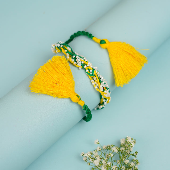 Handmade Reusable Yellow And Green Mirror And Jhumki Cotton Rope Rakhi For Bhaiya And Bhabhi - Rolled Display with Tassels